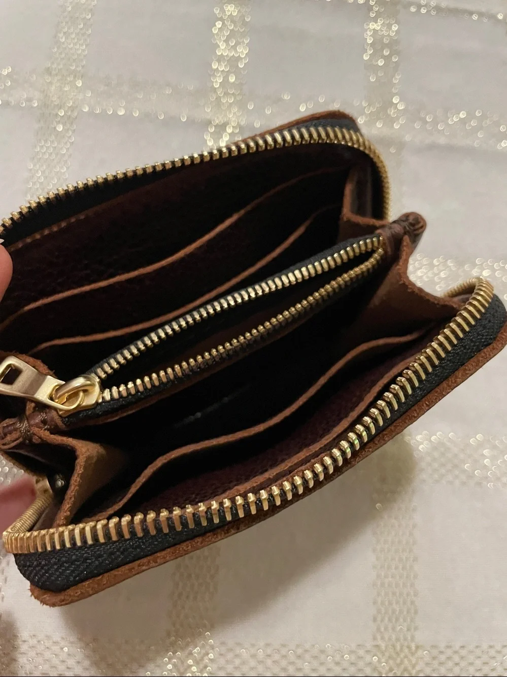 Portland Leather Goods brown wallet, gold tone zipper, inside holds coins/cards